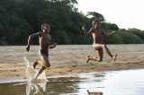 children running down the beach